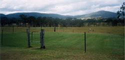 This is a view of the greens with the barbed wire fences around to keep out the animals and cattle
